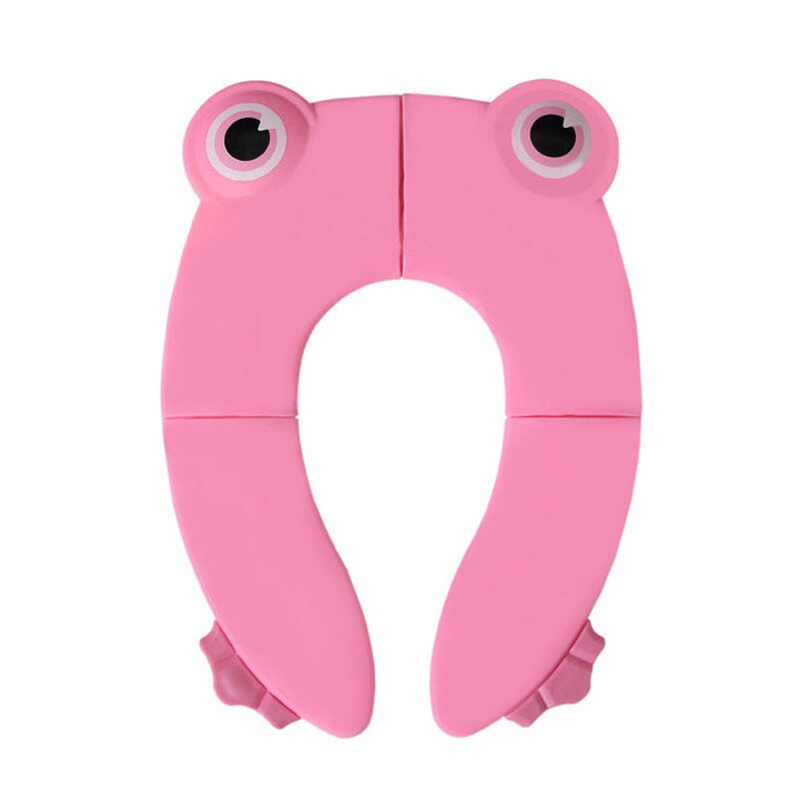 Compact children's folding portable potty seat next to a suitcase, emphasizing its travel readiness