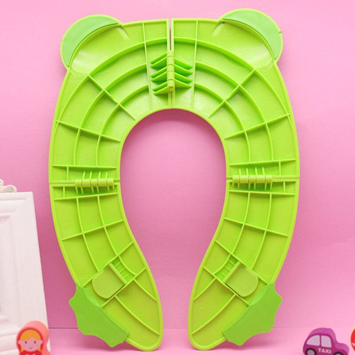Close-up of the non-slip silicone pads on a blue children's folding portable potty seat for safety