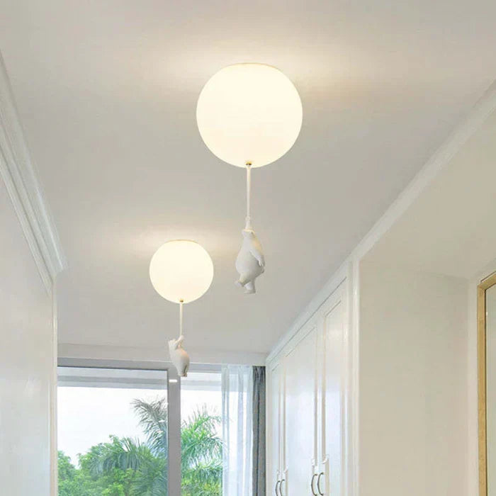 Detailed view of whimsical bear & balloon ceiling lamp, highlighting playful design for kids' rooms.