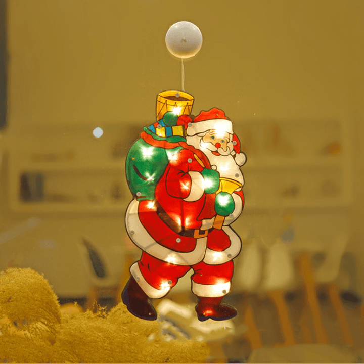 Evening shot of a home window adorned with multiple Christmas Suction Cup LED Lights, warm inviting glow