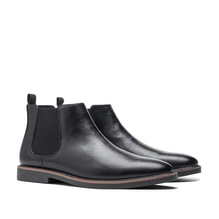 Stylish grey suede men's Chelsea boots, ankle height, offering comfort and a modern footwear choice.