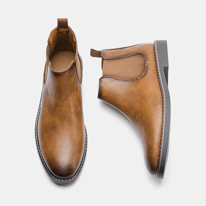 Classic brown men's Chelsea boots, easy slip-on, providing comfortable support for daily wear.