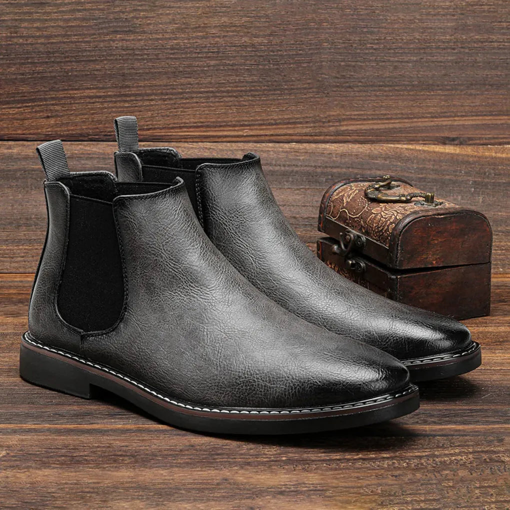 Men's rugged brown Chelsea boots, slip-on ankle design, great for casual comfort and durability.