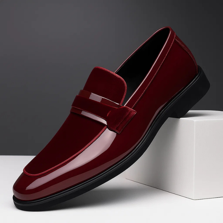 Elegant men's black leather slip-on penny loafers, classic design for comfortable everyday formal or casual style.