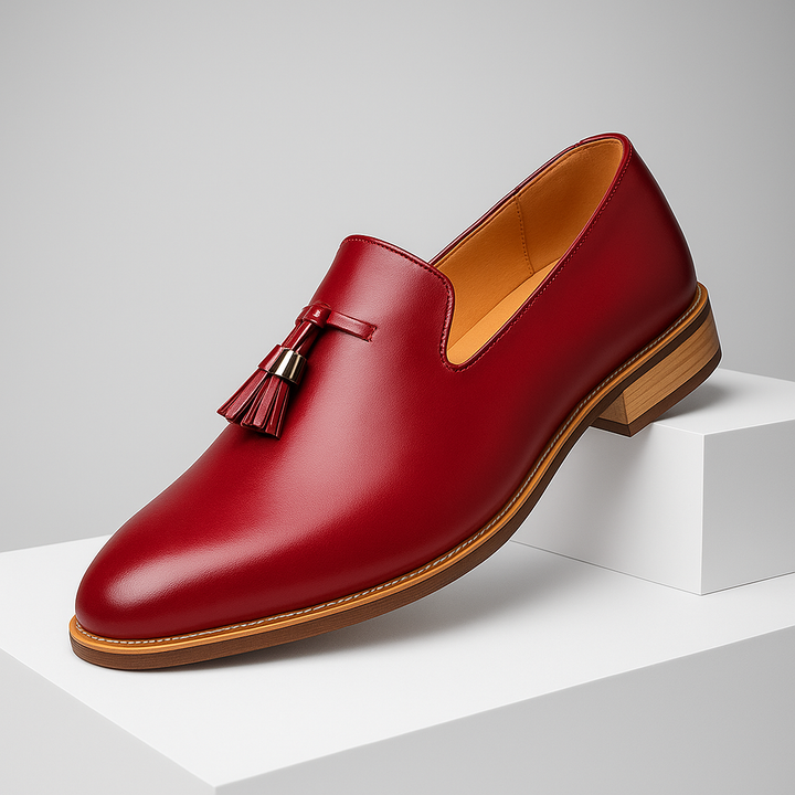Men's polished black leather tassel loafers, ideal for formal attire and comfortable all day.