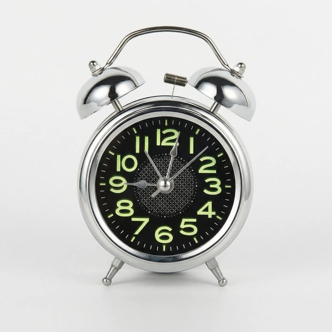 Vintage twin bell alarm clock, a silent bedside clock with a loud ring, ideal for heavy sleepers and retro decor.