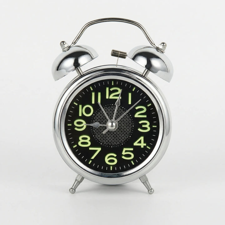 Vintage twin bell alarm clock, a silent bedside clock with a loud ring, ideal for heavy sleepers and retro decor.