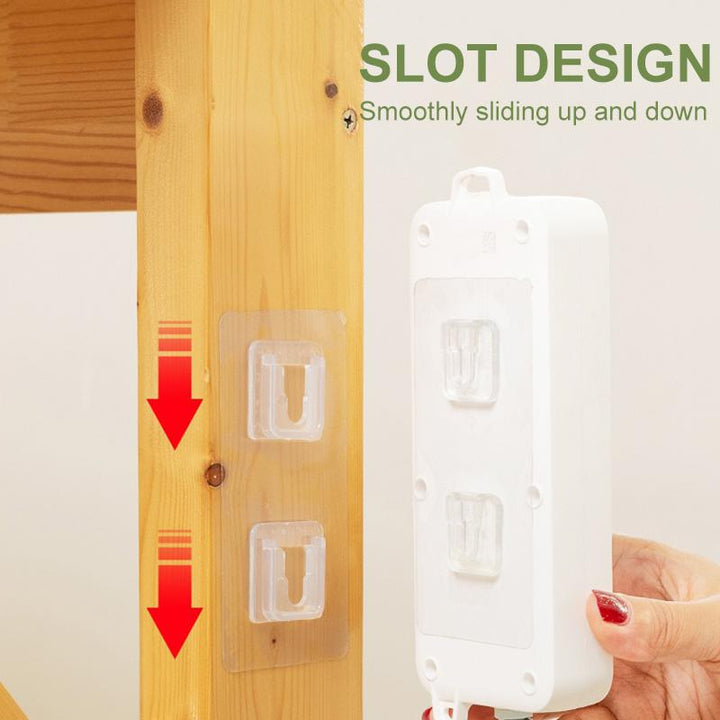Close-up of a clear double-sided adhesive wall hook showing strong non-marking adhesion for home use