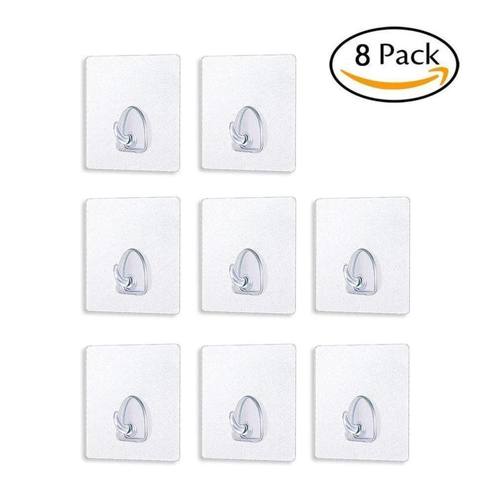 Set of clear reusable sticky hooks displayed, showing their discreet, seamless design for any room