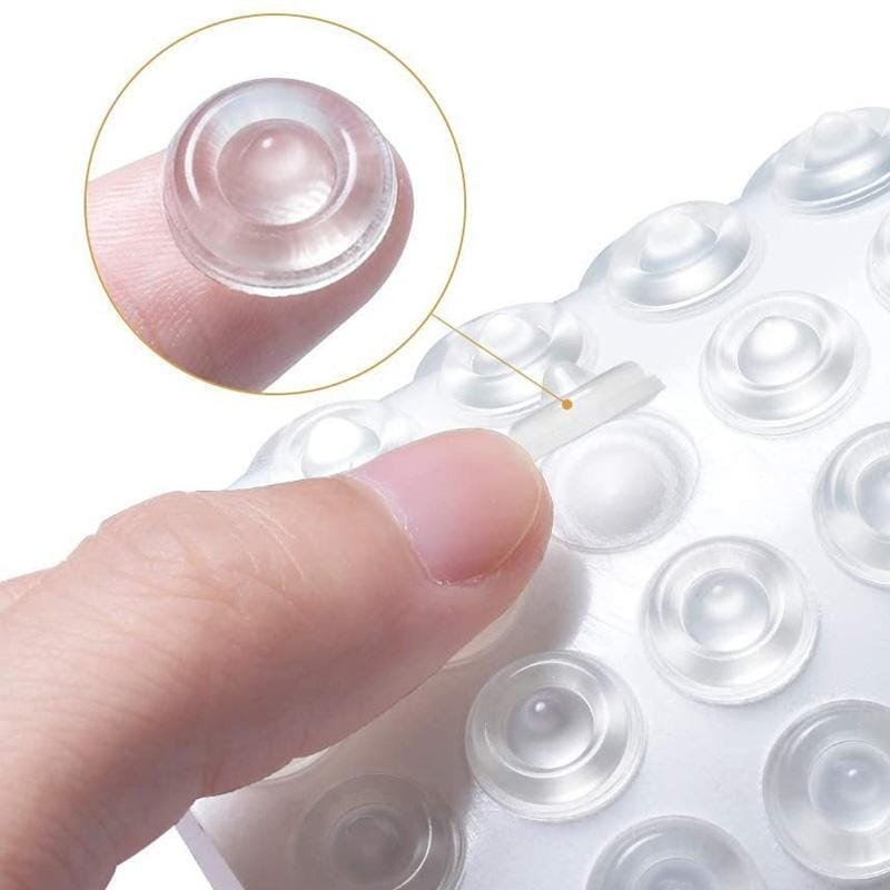 Close-up of clear round silicone pad cabinet bumper for noise reduction