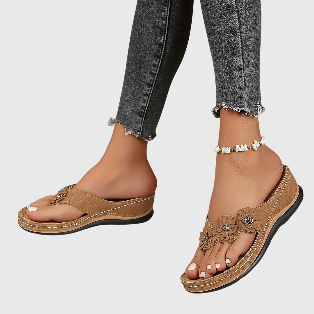 Orthopedic flip flops for women, showcasing ergonomic design for arch support & comfortable walking.