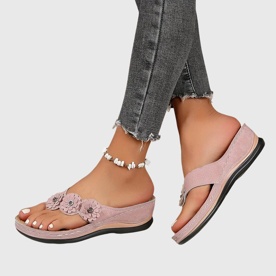 Women's beach-ready flip flops with advanced arch support technology for comfort and stability.
