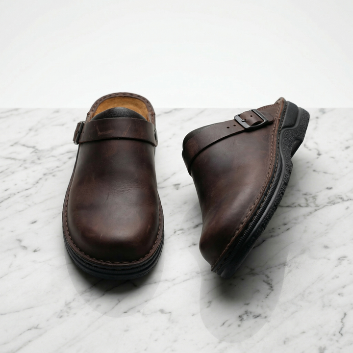 Comfortable dark brown unisex slip-on clogs. Ideal supportive footwear for stylish everyday casual wear.