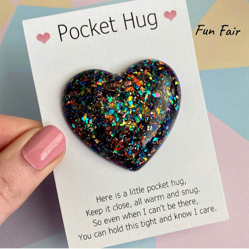 Close-up of the smooth, tactile surface of a resin Pocket Hug heart gift