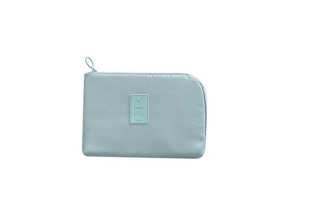 Unisex portable waterproof electronics organizer for cables, chargers & travel tech. Includes mini case.