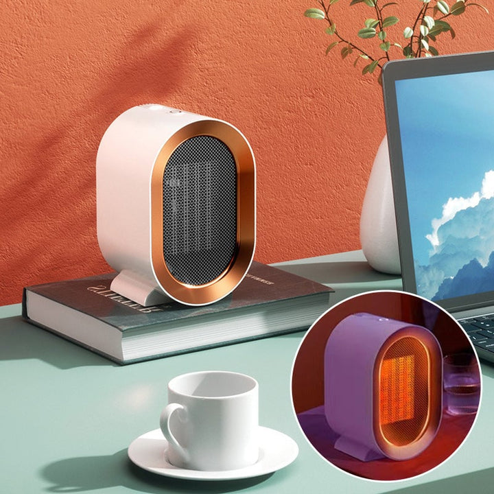Compact electric desktop space heater, white, for personal warmth in home office.