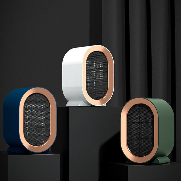 Small white electric desktop heater, perfect for warming a personal workspace.