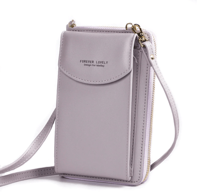 Stylish ladies' PU leather shoulder bag, compact design, features an adjustable strap.