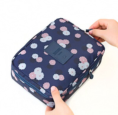 Women's travel makeup organizer, waterproof & compact, perfect for toiletries on the go.