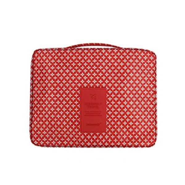 Waterproof dark blue cosmetic travel pouch, compact and portable, for beauty products.