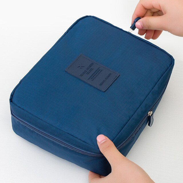 Women's compact beauty organizer, waterproof with sturdy zipper, ideal for travel.