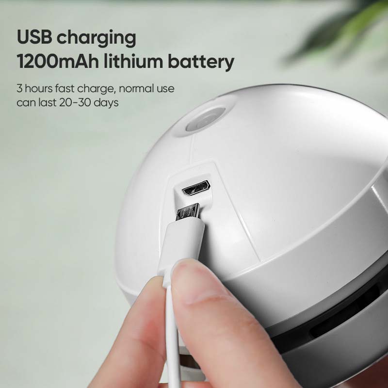 Portable mini vacuum cleaner in white, powered by USB, perfect for desk tidiness.