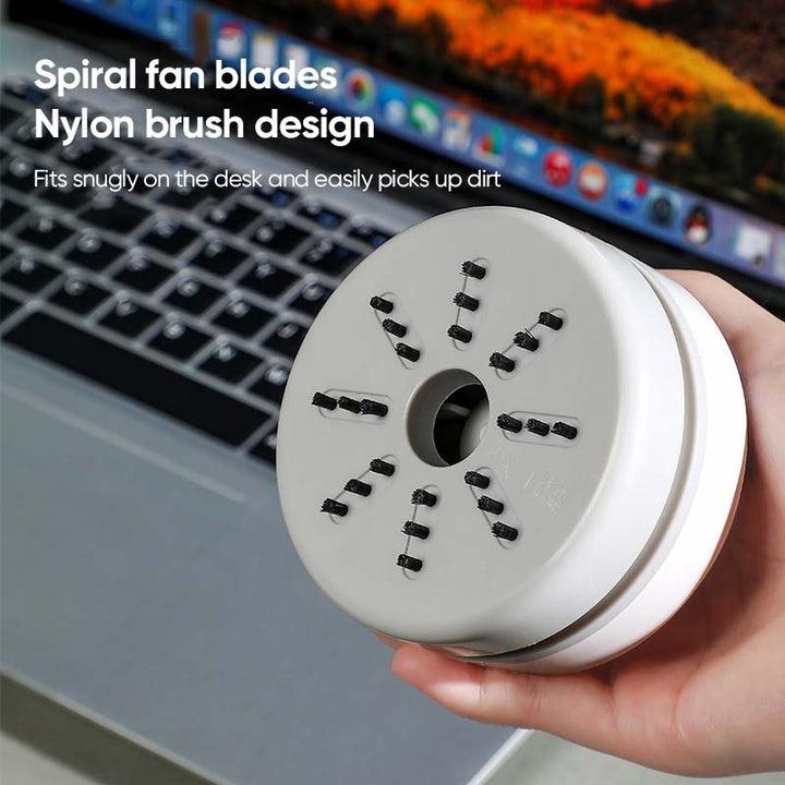 USB rechargeable mini vacuum for desktops, efficient and convenient for office use.