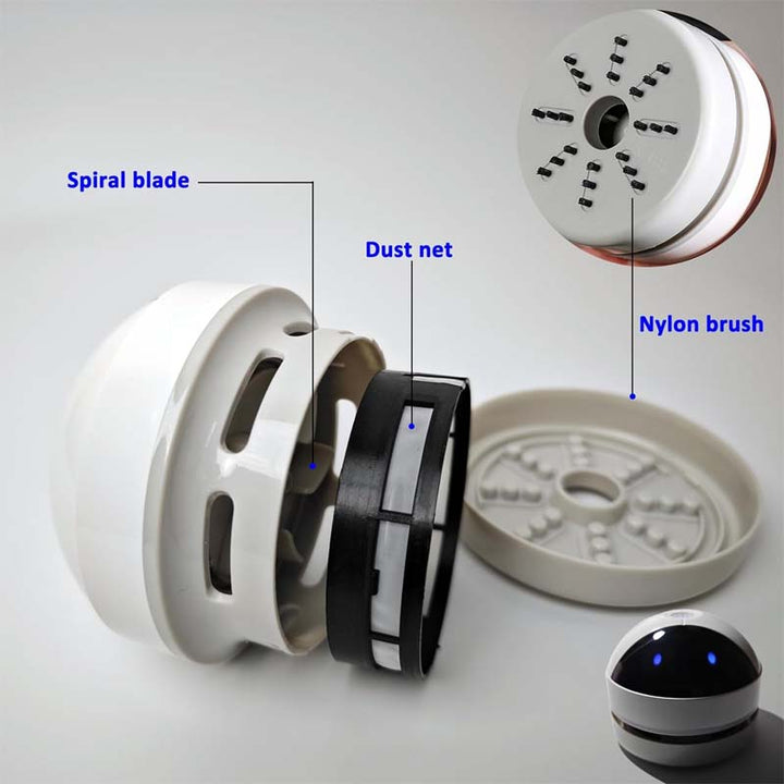 Portable white mini vacuum, designed for easy cleanup of crumbs and dust on desks.