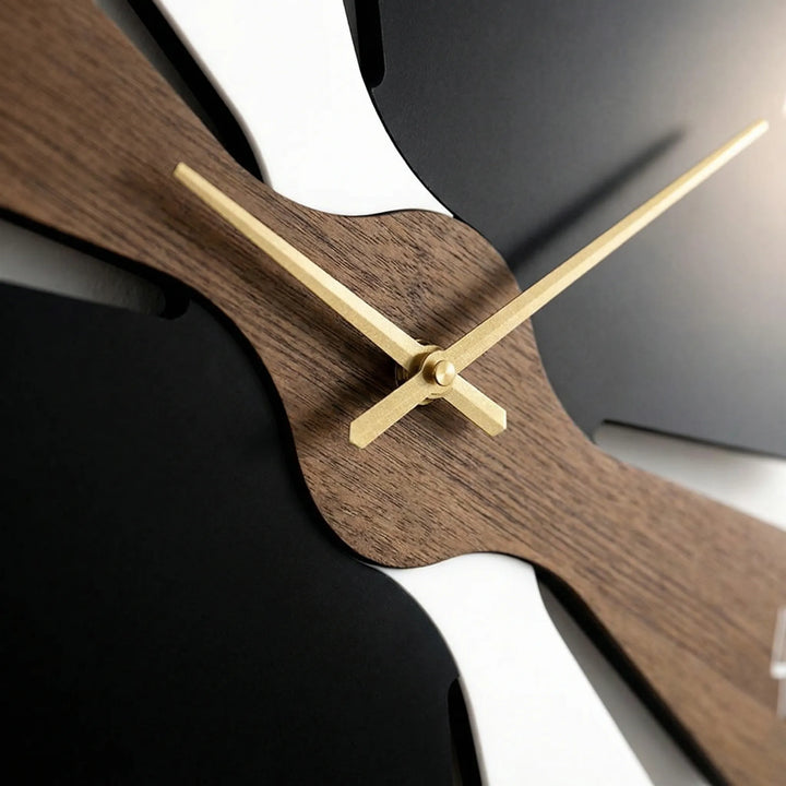 Sleek contemporary wall clock in black/gray, enhancing modern home decor. Perfect minimalist statement piece.