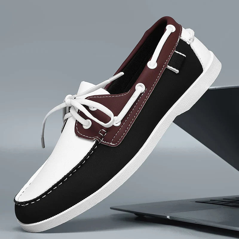 Dark-colored Corvan men's slip-on deck shoes, offering a sophisticated touch to men's casual footwear.