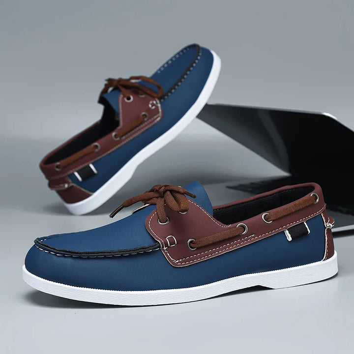 Side profile of Corvan men's vegan leather deck loafers, emphasizing the comfortable and lightweight construction.