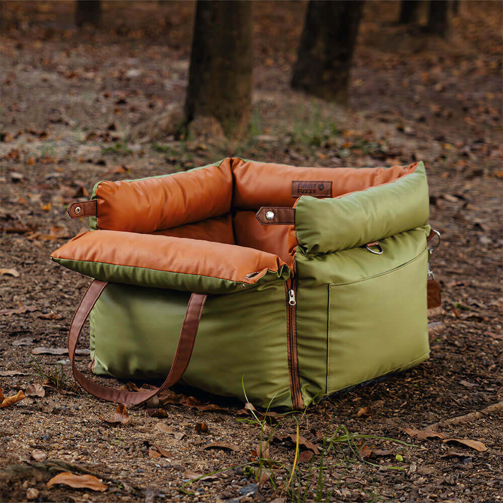 Cozy faux leather dog bed for car travel. Secure and comfortable pet booster seat.
