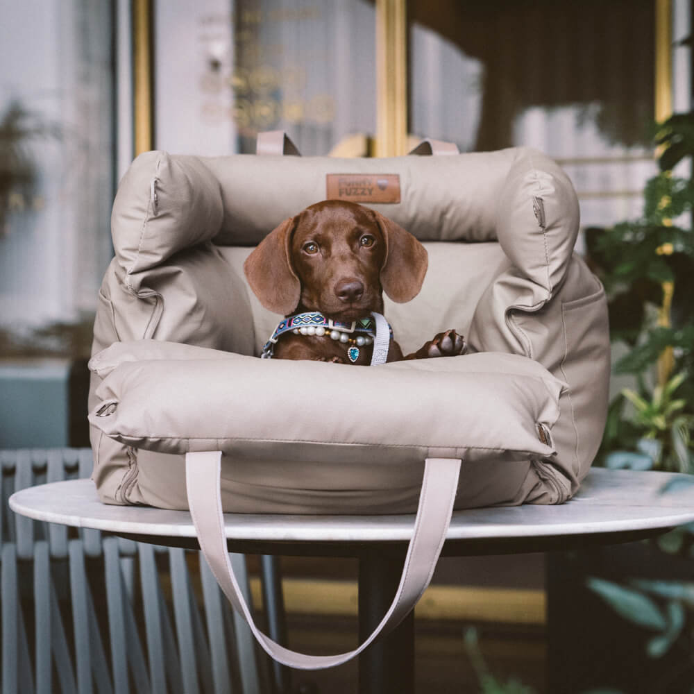 Safe dog car seat for small to medium pets. Faux leather, plush comfort, secure travel booster.