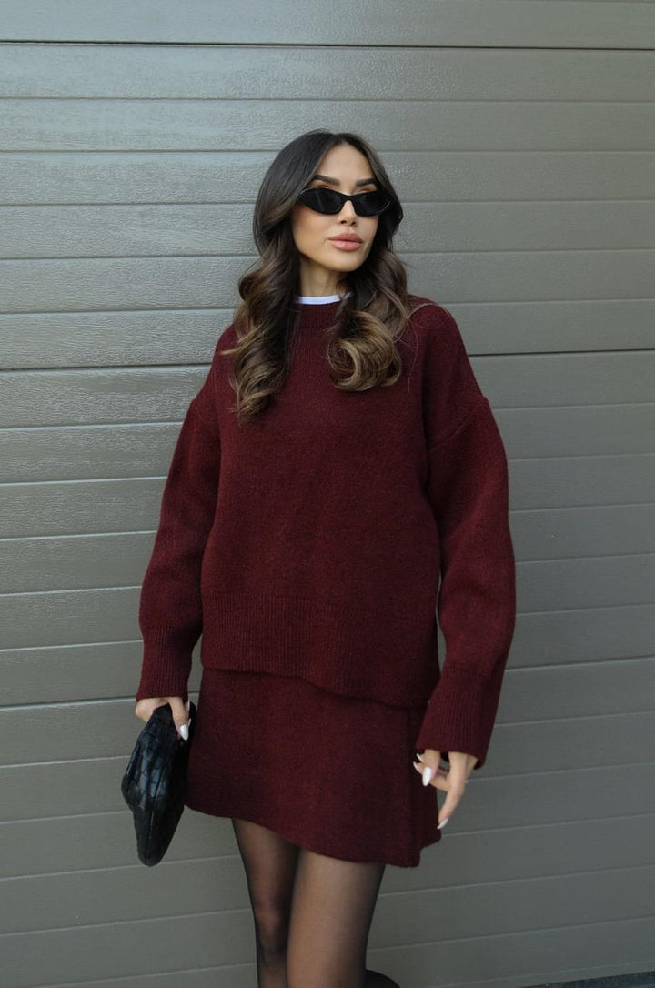 Cozy knit sweater and matching mini skirt set for women, perfect for a versatile spring outfit.
