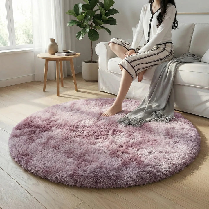 Stylish round tie-dye rug, a plush home decor accent adding modern design to your bedroom.