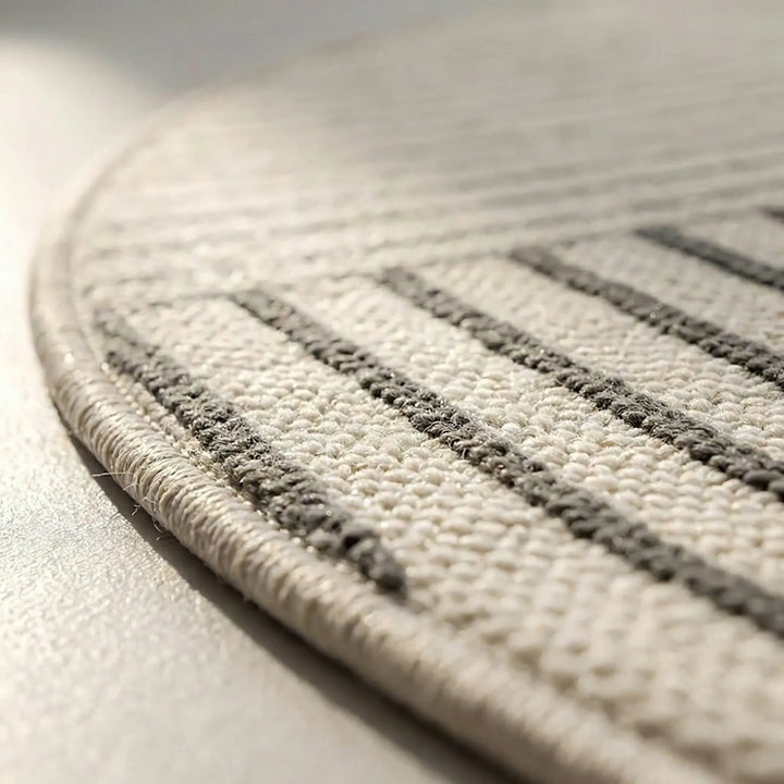 Soft, modern round area rug featuring a subtle wave design & non-slip backing for a cozy, safe feel in any room.