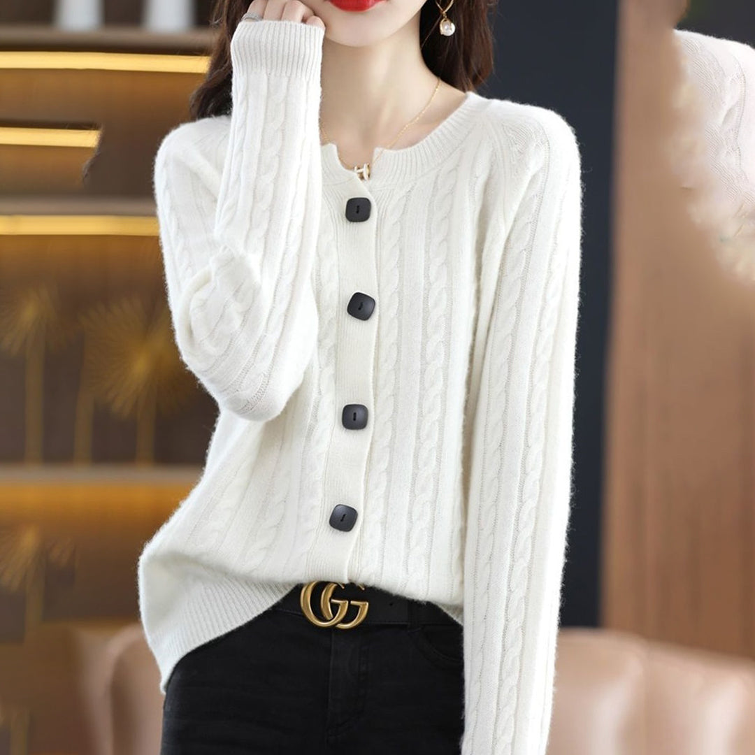 Women's relaxed fit cable-knit cardigan with buttons, ideal knitwear for cooler weather and outerwear.