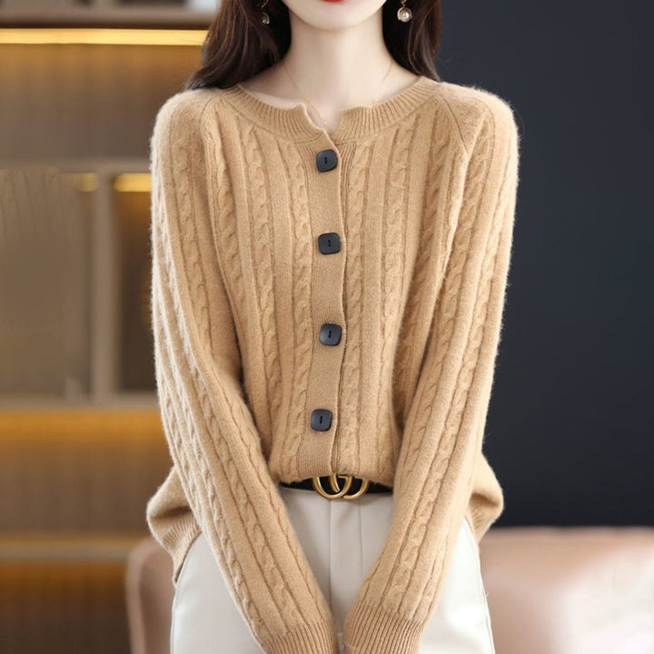 Detail of the button closure on a women's cozy, relaxed fit cardigan, showcasing quality knitwear.