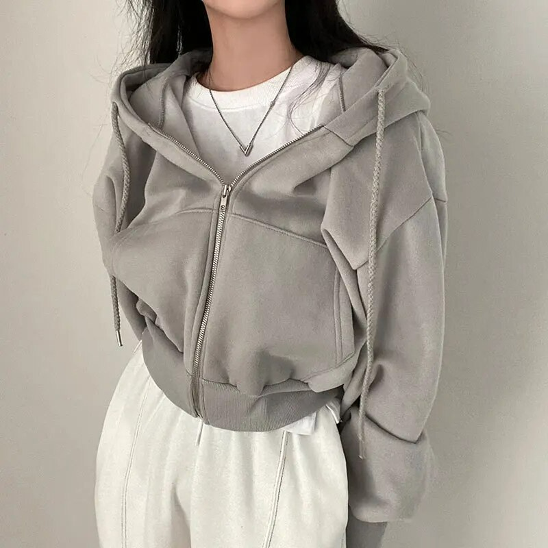 Front view of a women's cropped zip-up winter hoodie, perfect for athleisure and loungewear.