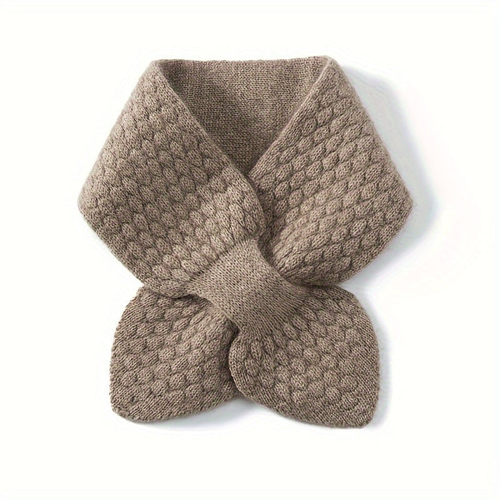 Textured shot of a women's knitted neck warmer, for warmth and stylish autumn fashion.