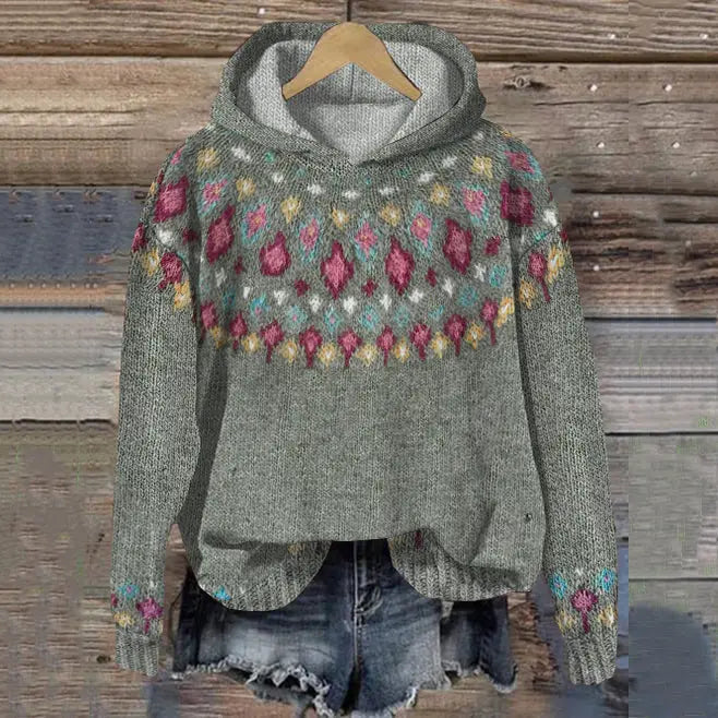 Cozy women's Nordic knit hoodie in a warm grey, perfect for comfortable winter fashion and casual Scandinavian style.