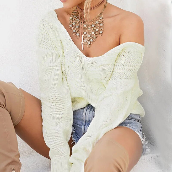 Relaxed fit women's long sleeve knitted sweater, ideal for versatile winter outfits.