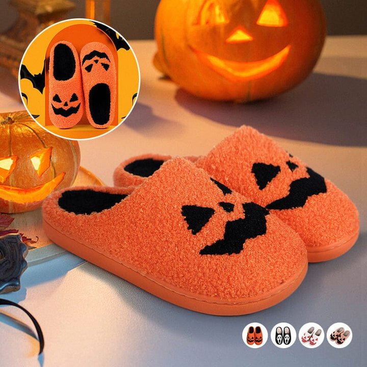 Cozy women's plush house slippers with a smiling pumpkin design, perfect for autumn & Halloween.