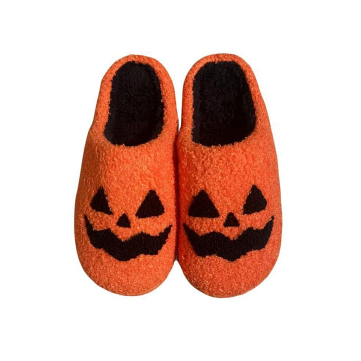Women's cozy autumn slippers, made from soft plush material with a friendly pumpkin design.