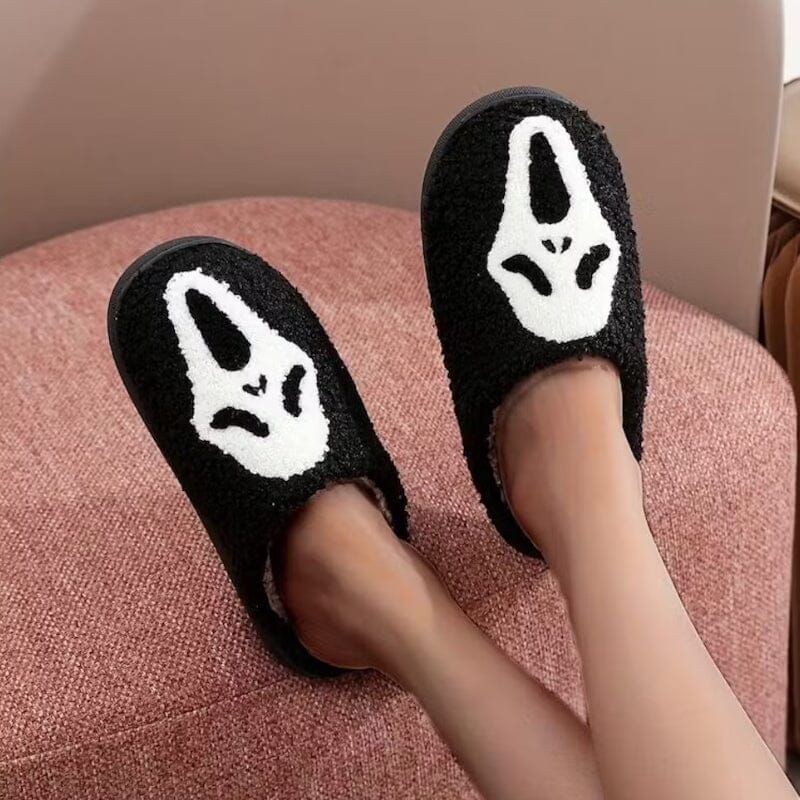 Side view of a women's plush pumpkin slipper, highlighting the comfortable, soft material.