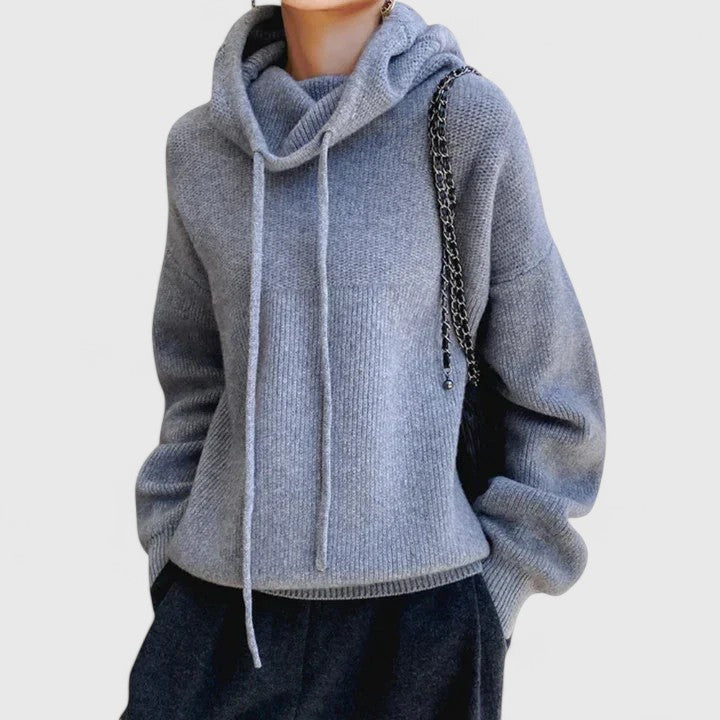 Close-up of women's relaxed fit cowl neck pullover sweater, highlighting adjustable drawstring for extra style.