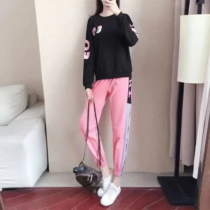 Women's fall fashion tracksuit outfit; a cozy long-sleeve sweater and comfortable pants for casual wear.