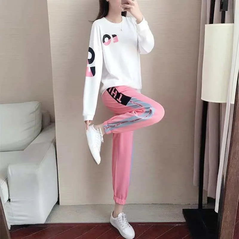 Women's comfortable two-piece tracksuit with crewneck sweater & elastic-waist pants, great for active casual wear.