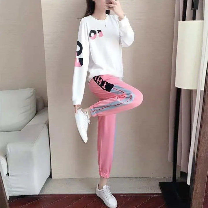 Women's comfortable two-piece tracksuit with crewneck sweater & elastic-waist pants, great for active casual wear.