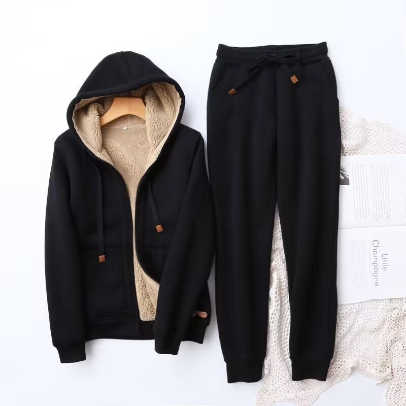 Cozy women's winter hoodie and jogger set in a soft, heather gray fabric, perfect for loungewear or casual outfits.